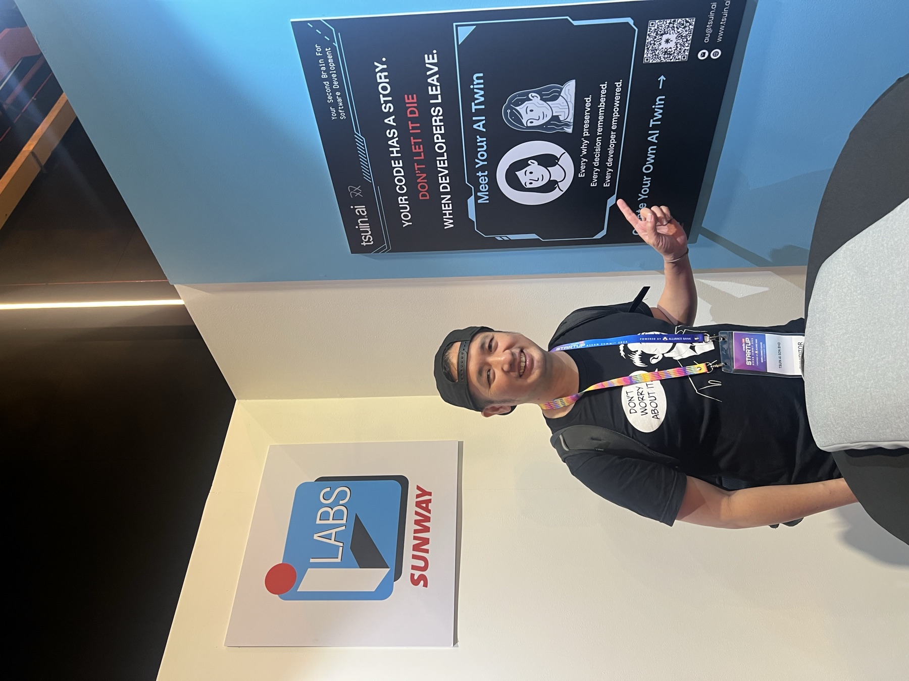 The tsuin.ai booth poster: your code has a story